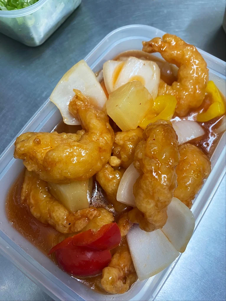 Sweet and sour chicken with pineapple, peppers and onion