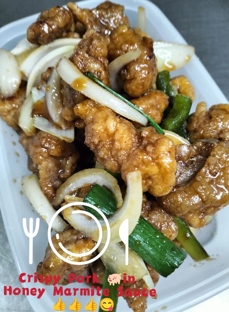 Crispy pork in honey Marmite sauce with spring onion